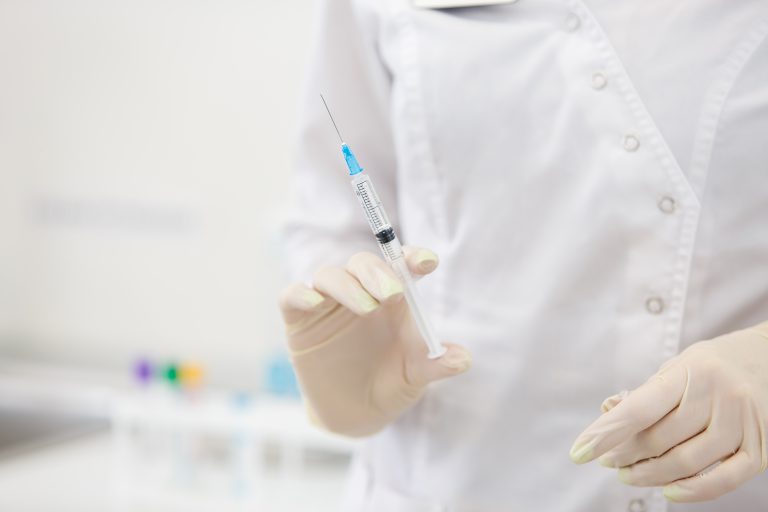 Scientist holding a needle